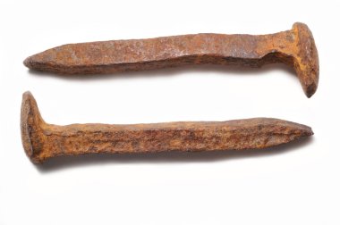 Old rusty railroad spikes isolated clipart