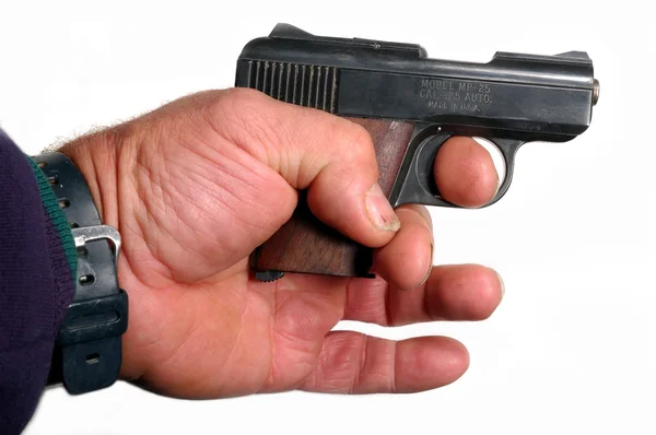 Małe półautomatyczne pistolety w ręku na białym tle — Zdjęcie stockowe