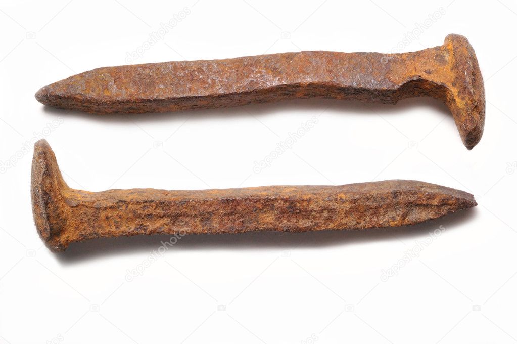Old rusty railroad spikes isolated