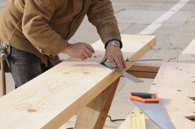 Carpenter marking out steps on a stringer clipart