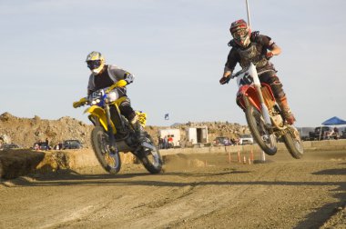 Dirt bike racers on track clipart