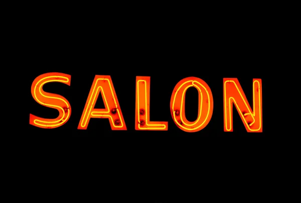 Neonskylt med ordet "salon" över svart — Stockfoto