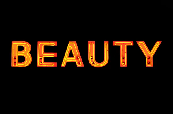 Neonový nápis se slovem "krása" nad černou — Stock fotografie
