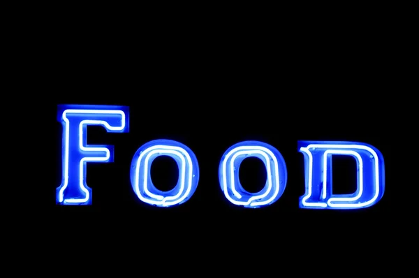 Неоновий знак зі словом "Їжа" над чорним — стокове фото