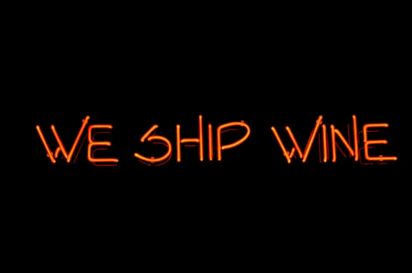 stock image Orange Neon sign - we ship wine