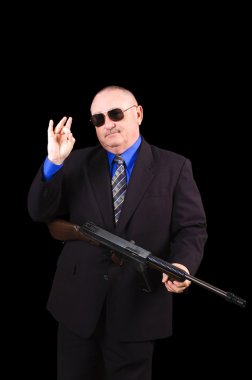 Gangster or Government agent, FBI agent, over a black background clipart