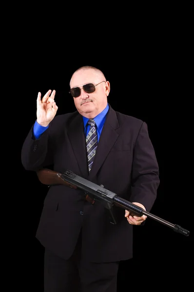 Gangster o agente governativo, agente dell'FBI, su sfondo nero — Foto Stock