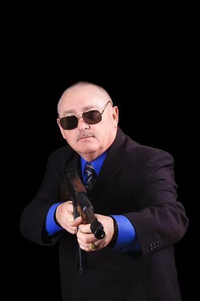 Гангстер или правительственный агент, агент ФБР, на черном фоне — стоковое фото