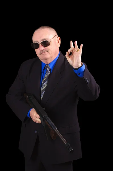 Gangster ou agente do governo, agente do FBI, sobre um fundo negro — Fotografia de Stock