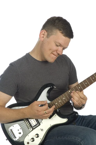 Guitarrista tocando no branco — Fotografia de Stock