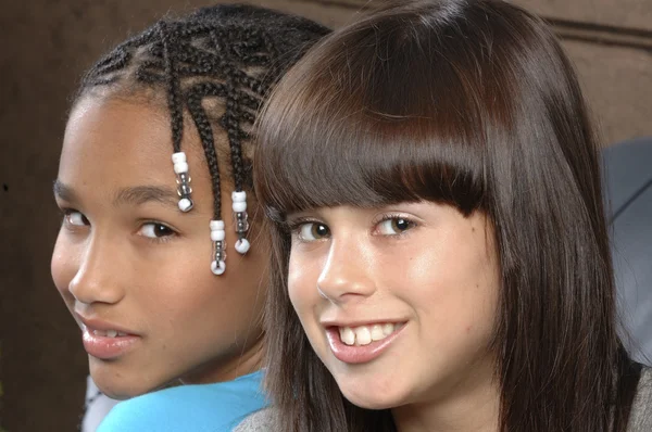 Cute african american girl with caucasian girl freind