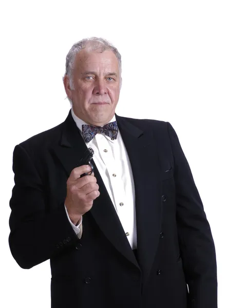 Older businessman impersonating James Bond — Stock Photo, Image