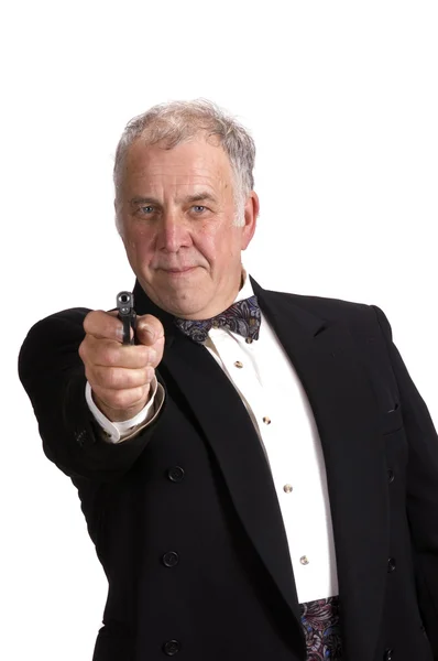 Older businessman impersonating James Bond — Stock Photo, Image