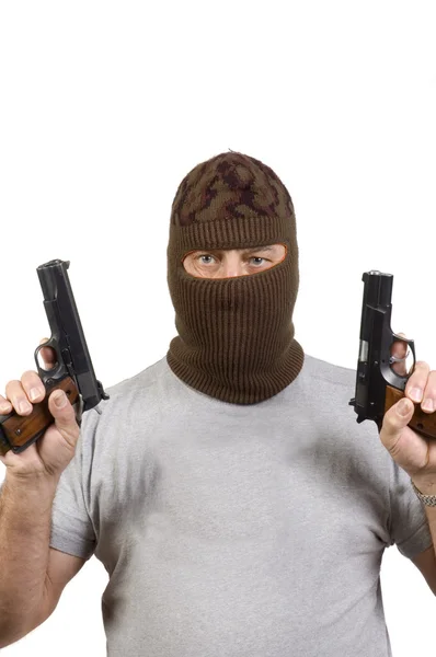 Homem mascarado com duas pistolas semi-automáticas isoladas em branco — Fotografia de Stock