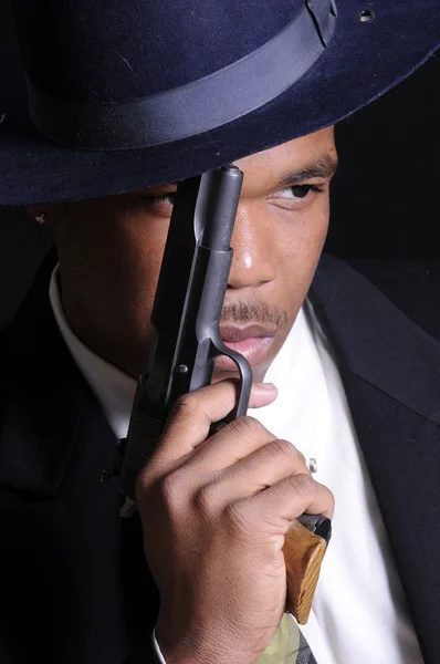 Young African American man with semi-auto — Stock Photo, Image
