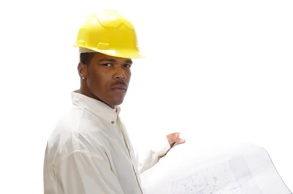 Young African American engineer studying house plans — Stock Photo, Image