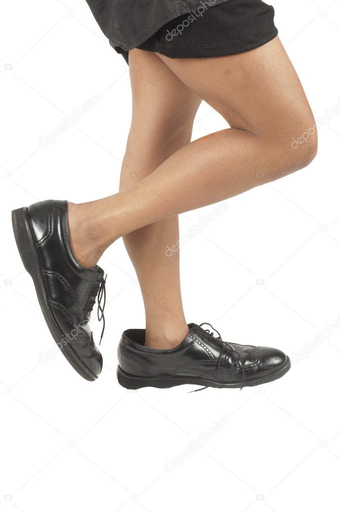 Black woman walking in mans shoes