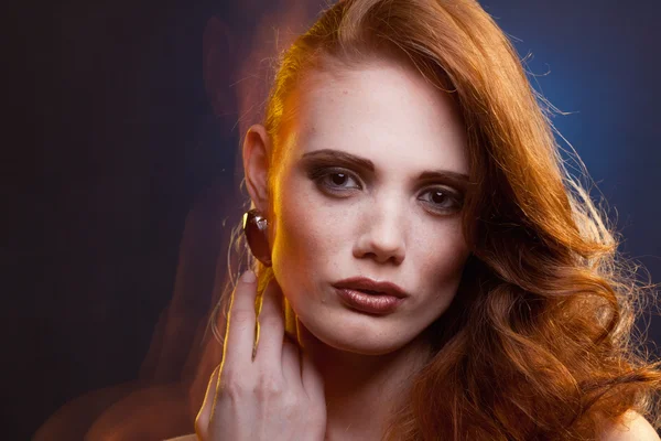 Portrait of red-haired girl in a mixed light — Stock Photo, Image