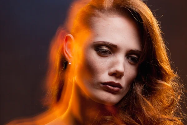 Portrait of red-haired girl in a mixed light — Stock Photo, Image
