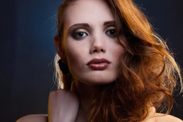 stock image Portrait of red-haired girl in a mixed light