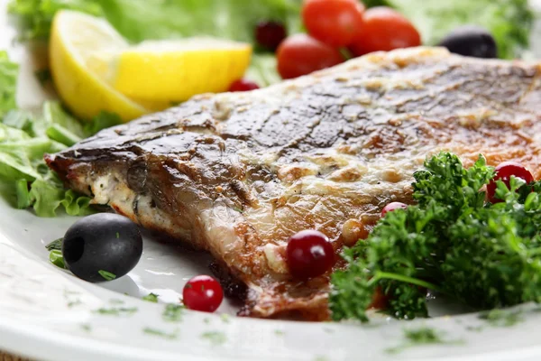 Fish with berries — Stock Photo, Image