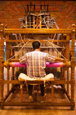 Weaver Using Hand Loom Making Sari clipart