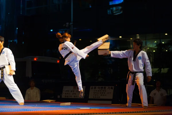 stock image Korean Taekwondo Girl Jump Kicking Breaking Board