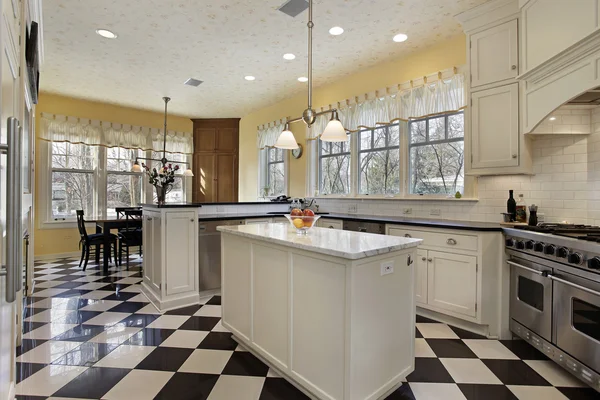 Kitchen with black and white flooring — Stock Photo, Image