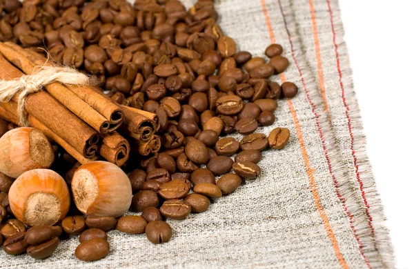 Nuts, coffee beans and cinnamon — Stock Photo, Image