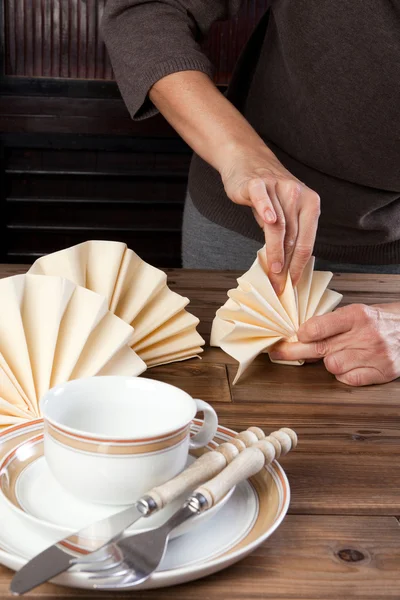 Folding napkins for lunch — Stock Photo, Image