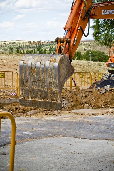 Construction site with excavating equipment — Stock Photo, Image