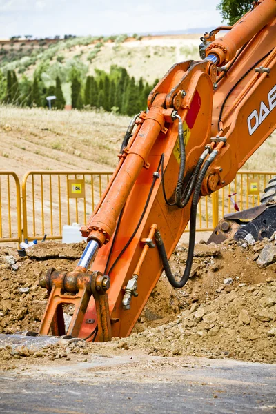 Excavator loader machine during earthmoving works outdoors at co — Stock Photo, Image