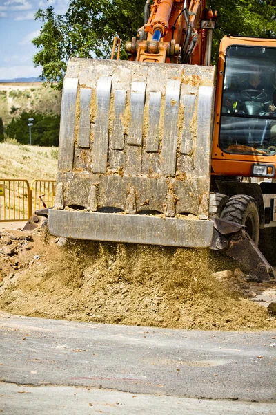 Orange coloured heavy construction digger — Stock Photo, Image