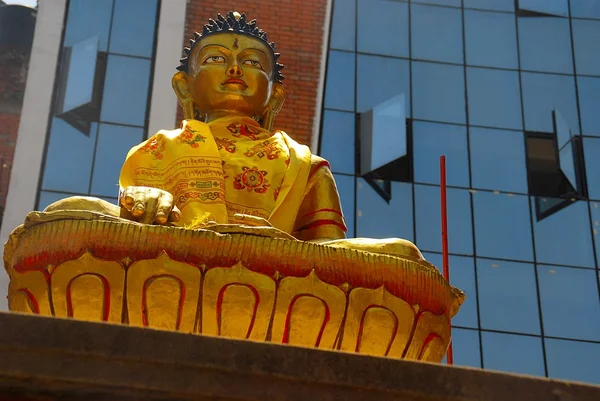 A statue of Buddha in front of the modern building in Kathmandu, Nepal — Stock Photo, Image