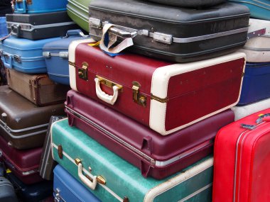 Vintage Suitcases In A Pile clipart