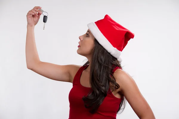Christmas girl holding a car key — Stock Photo, Image