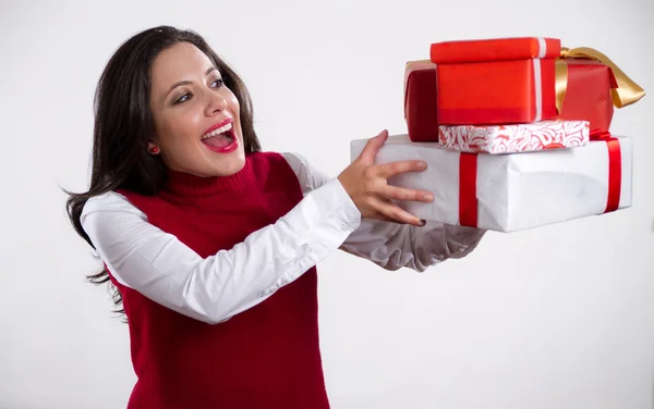 Young mother holding christmas gifts — Stock Photo, Image