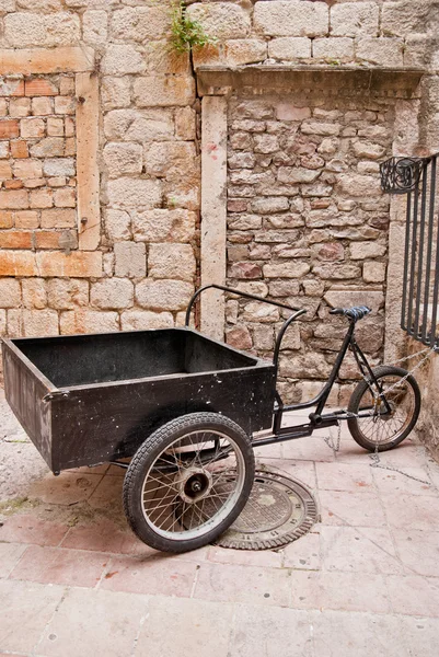 A tricycle in the narrow street — Stock Photo, Image