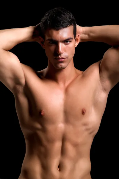 건강 한 근육 질의 젊은 남자. 검은 배경에 고립. — 스톡 사진