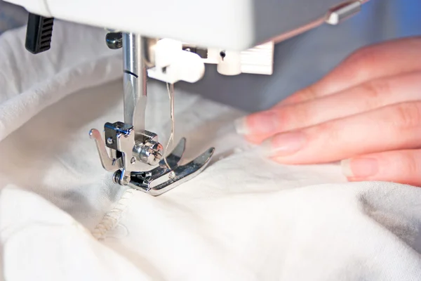 stock image Hand sewing on a machine