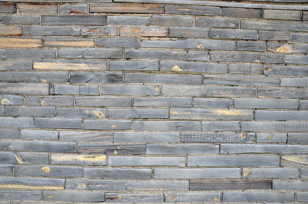 Un zid de cărămizi din lemn . — Fotografie, imagine de stoc