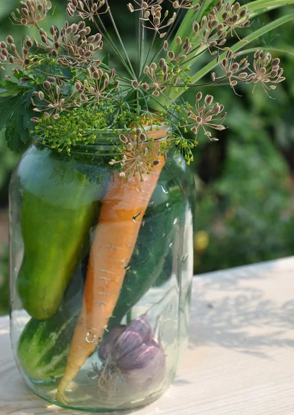Fresh vegetables in a glass jar. — Stock Photo, Image