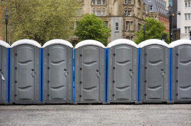 Portaloos at an outdoor event clipart