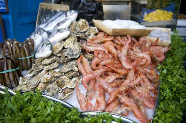 Oysters and prawns for sale clipart