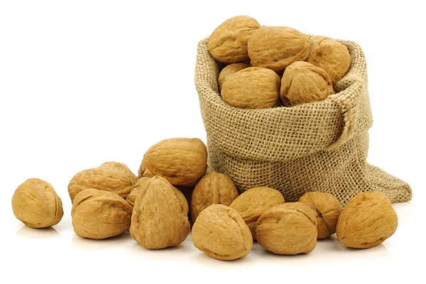 Fresh walnuts in a burlap bag — Stock Photo, Image