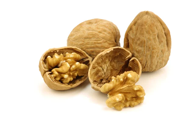 Two fresh walnuts and a cracked one — Stock Photo, Image