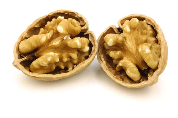 Two cracked fresh walnut halves — Stock Photo, Image