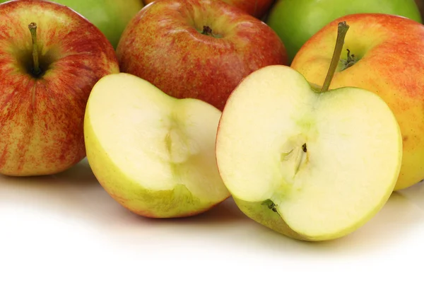 Mixed fresh apples and a cut one — Stock Photo, Image