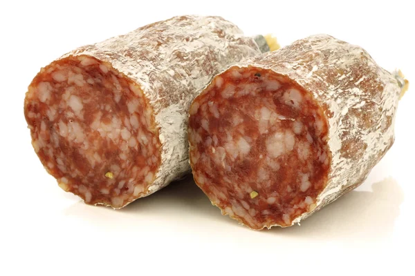 Spicy Italian salami sausage halves — Stock Photo, Image