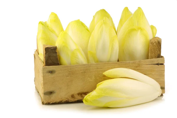 Fresh chicory in a wooden crate — Stock Photo, Image